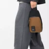 Bolso bandolera Flex en lona y ante Negro/Oro oscuro Bolso bandolera Flex en lona y ante Negro/Oro oscuro