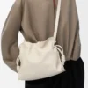 Bolso de mano Flamenco mediano en piel de becerro napa Sea Salt Bolso de mano Flamenco mediano en piel de becerro napa Sea Salt