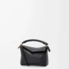 Bolso Mini Puzzle Edge en piel de becerro granulada suave, color negro Bolso Mini Puzzle Edge en piel de becerro granulada suave, color negro