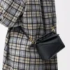 Bolso Mini Puzzle Edge en piel de becerro granulada suave, color negro Bolso Mini Puzzle Edge en piel de becerro granulada suave, color negro