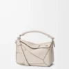 Bolso Panta pequeño Puzzle en piel de becerro brillante Light Ghost Bolso Panta pequeño Puzzle en piel de becerro brillante Light Ghost