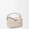 Bolso Panta pequeño Puzzle en piel de becerro brillante Light Ghost Bolso Panta pequeño Puzzle en piel de becerro brillante Light Ghost