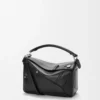 Bolso Panta pequeño Puzzle en piel de becerro brillante Negro Bolso Panta pequeño Puzzle en piel de becerro brillante Negro