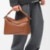 Bolso Puzzle Edge grande en piel de becerro clásica color tostado Bolso Puzzle Edge grande en piel de becerro clásica color tostado