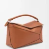 Bolso Puzzle Edge grande en piel de becerro clásica color tostado Bolso Puzzle Edge grande en piel de becerro clásica color tostado