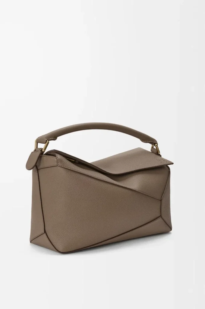 Bolso Puzzle Edge mediano en piel de becerro granulada suave Taupe Bolso Puzzle Edge mediano en piel de becerro granulada suave Taupe