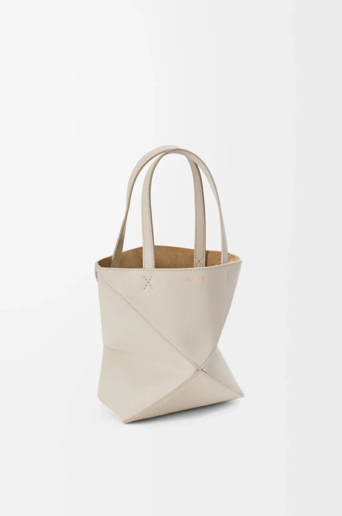Bolso tote Mini Puzzle Fold en piel de becerro granulada suave Light Ghost Bolso tote Mini Puzzle Fold en piel de becerro granulada suave Light Ghost