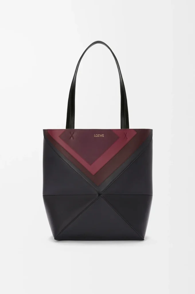 Bolso tote Puzzle Fold mediano en piel de becerro napa Negro/Burdeos Bolso tote Puzzle Fold mediano en piel de becerro napa Negro/Burdeos
