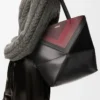 Bolso tote Puzzle Fold mediano en piel de becerro napa Negro/Burdeos Bolso tote Puzzle Fold mediano en piel de becerro napa Negro/Burdeos