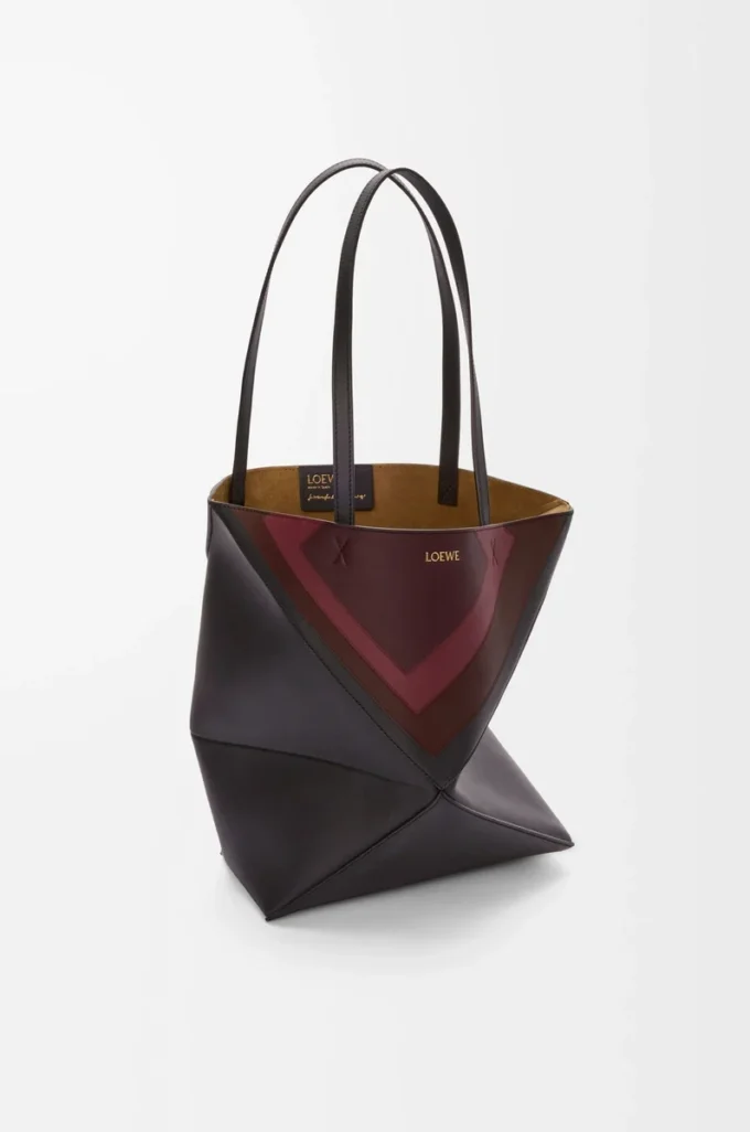 Bolso tote Puzzle Fold mediano en piel de becerro napa Negro/Burdeos Bolso tote Puzzle Fold mediano en piel de becerro napa Negro/Burdeos