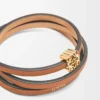 Brazalete trenzado en piel de becerro color tostado Brazalete trenzado en piel de becerro color tostado