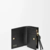 Cartera compacta Knot en piel de anguila negra Cartera compacta Knot en piel de anguila negra