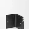 Cartera compacta y delgada Puzzle en piel de becerro granulada flexible. Negro
