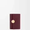 Cartera pequeña vertical Pebble en piel de becerro napa brillante color burdeos Cartera pequeña vertical Pebble en piel de becerro napa brillante color burdeos