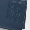 Cartera plegable para monedas en piel de becerro satinada teñida en índigo Cartera plegable para monedas en piel de becerro satinada teñida en índigo