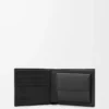 Cartera plegable Puzzle para monedas en piel de becerro granulada flexible, color negro Cartera plegable Puzzle para monedas en piel de becerro granulada flexible, color negro