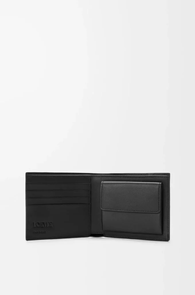 Cartera plegable Puzzle para monedas en piel de becerro granulada flexible, color negro Cartera plegable Puzzle para monedas en piel de becerro granulada flexible, color negro