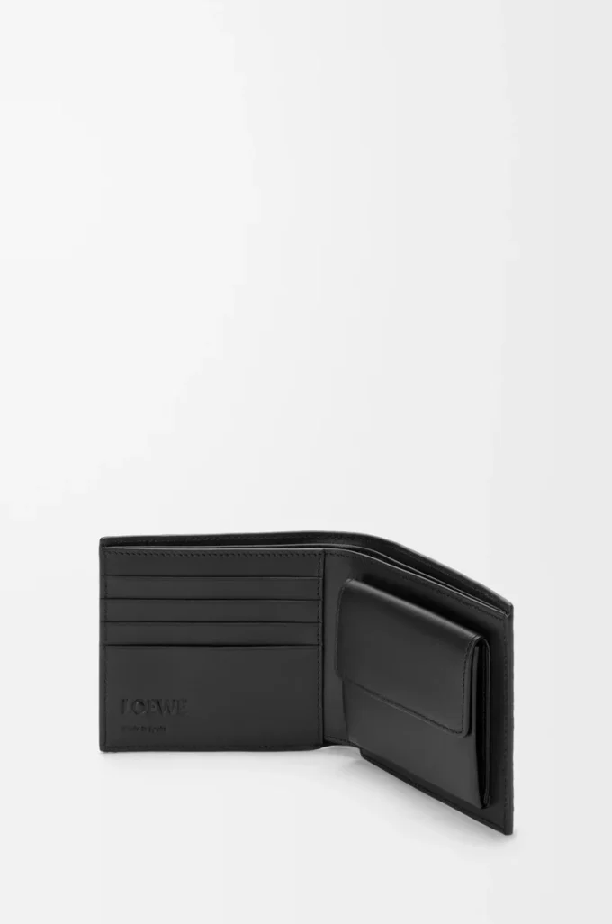 Cartera plegable Puzzle para monedas en piel de becerro granulada flexible, color negro Cartera plegable Puzzle para monedas en piel de becerro granulada flexible, color negro