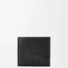 Cartera plegable Puzzle para monedas en piel de becerro granulada flexible, color negro Cartera plegable Puzzle para monedas en piel de becerro granulada flexible, color negro