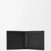 Cartera Puzzle con doble pliegue en piel de becerro granulada flexible, color negro Cartera Puzzle con doble pliegue en piel de becerro granulada flexible, color negro