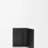 Funda para pasaporte Puzzle en piel de becerro granulada flexible. Color negro. Funda para pasaporte Puzzle en piel de becerro granulada flexible. Color negro.