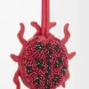 Llavero con forma de mariquita en cuero con cuentas color rojo rubí Llavero con forma de mariquita en cuero con cuentas color rojo rubí