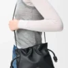 Mini bolso de mano Flamenco en piel de becerro napa negro Mini bolso de mano Flamenco en piel de becerro napa negro