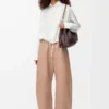 Pantalones acampanados de piel de cordero napa Beige Pantalones acampanados de piel de cordero napa Beige