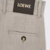Pantalones cropped cruzados de lana en color beige claro jaspeado Pantalones cropped cruzados de lana en color beige claro jaspeado