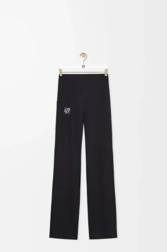 Pantalones suaves de corte acampanado en jersey técnico negro Pantalones suaves de corte acampanado en jersey técnico negro