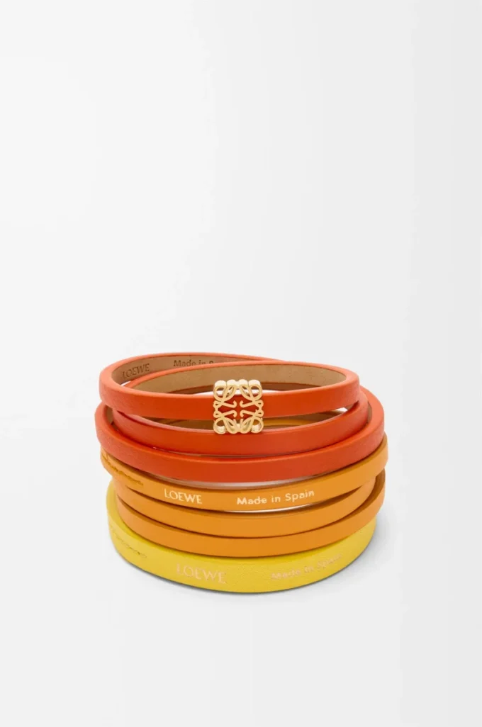 Pulsera doble trenzada en piel de becerro Naranja vivo/Amarillo Pulsera doble trenzada en piel de becerro Naranja vivo/Amarillo