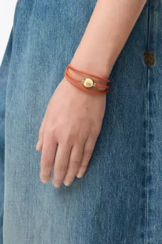 Pulsera Pebble de piel de becerro naranja/dorada