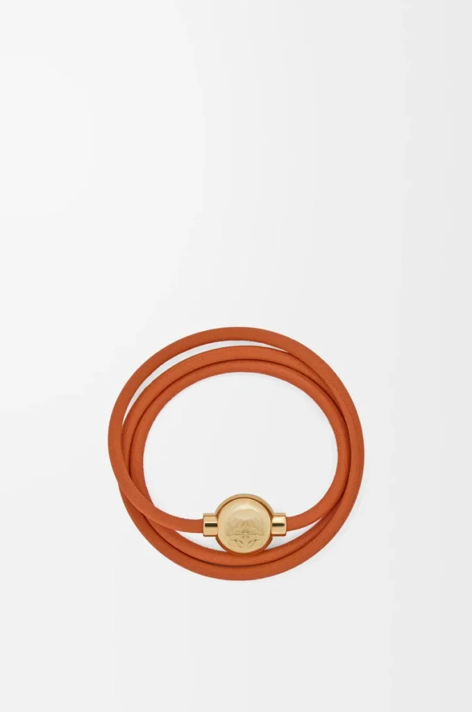 Pulsera Pebble de piel de becerro naranja/dorada
