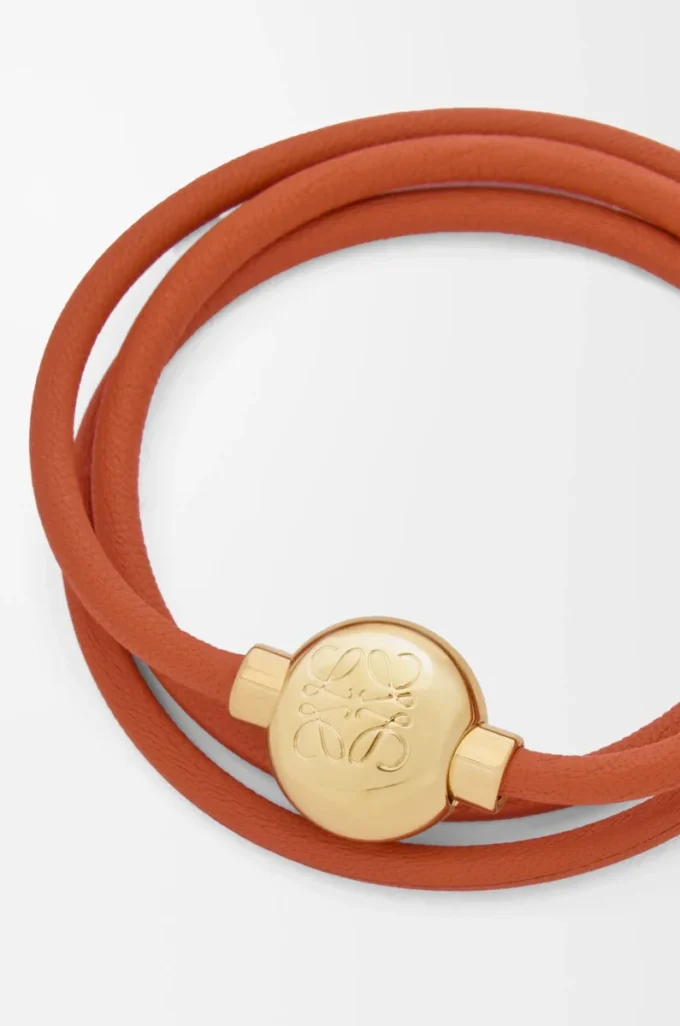 Pulsera Pebble de piel de becerro naranja/dorada